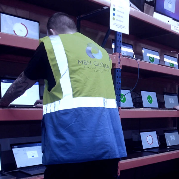 MBH staff working at a laptop